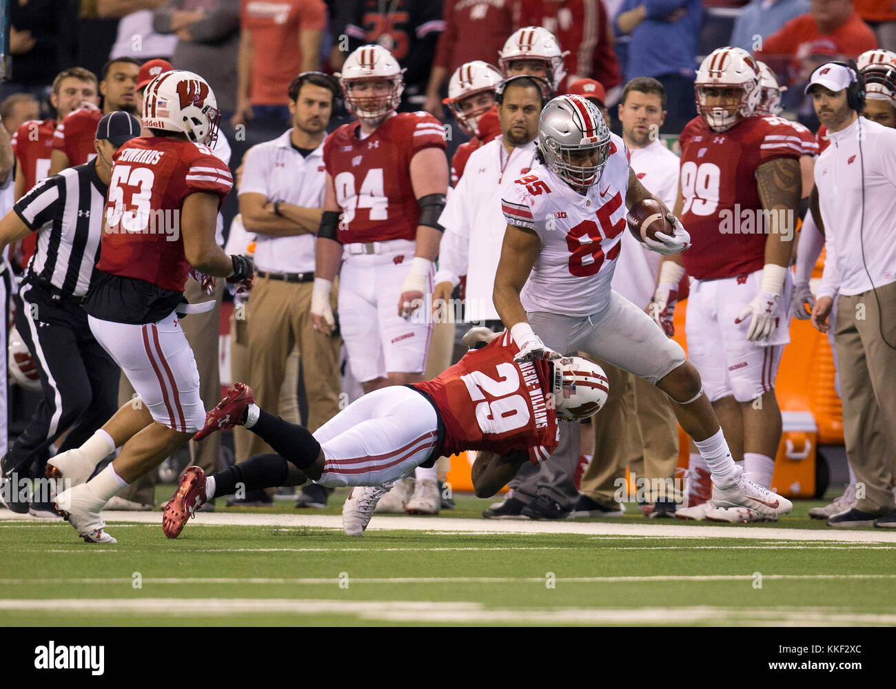 Indianapolis, Indiana, USA. 02nd Dec, 2017. Ohio State tight end Marcus Baugh (85) runs with the ball after the catch as Wisconsin defensive back Dontye Carriere-Williams (29) attempts to make the tackle during NCAA Football game action between the Ohio State Buckeyes and the Wisconsin Badgers at Lucas Oil Stadium in Indianapolis, Indiana. Ohio State defeated Wisconsin 27-21. John Mersits/CSM/Alamy Live News Stock Photo
