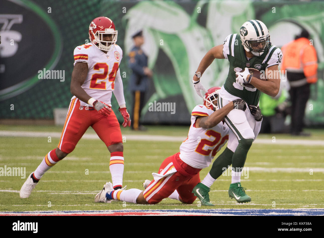 East Rutherford, New Jersey, USA. 3rd Dec, 2017. New York Jets wide receiver Jermaine Kearse (10) runs after the catch as Kansas City Chiefs cornerback Steven Nelson (20) tries to drag him down with cornerback Darrelle Revis (24) behind him during the NFL game between the Kansas City Chiefs and the New York Jets at MetLife Stadium in East Rutherford, New Jersey. Christopher Szagola/CSM/Alamy Live News Stock Photo