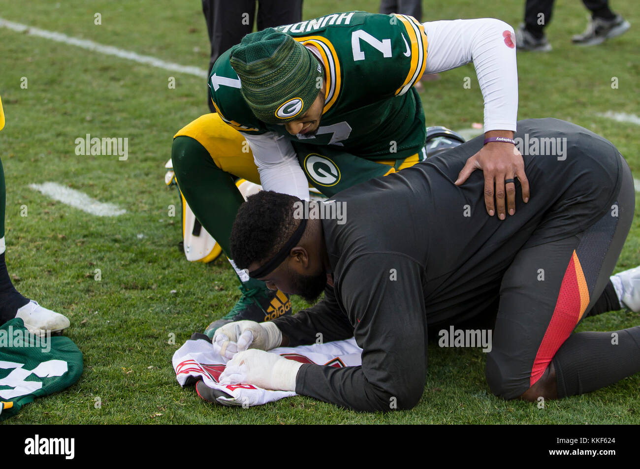 December 3, 2017: Green Bay Packers quarterback Brett Hundley #7 talks with Tampa Bay Buccaneers offensive guard Caleb Benenoch #77 after the NFL Football game between the Tampa Bay Buccaneers and the Green Bay Packers at Lambeau Field in Green Bay, WI. Packers defeated the Buccaneers in overtime 26-20. John Fisher/CSM Stock Photo