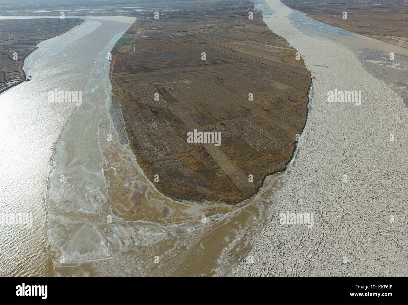 Hohhot. 5th Dec, 2017. Photo taken on Dec. 5, 2017 shows the frozen Yellow River at Togtoh section in north China's Inner Mongolia Autonomous Region. The length of frozen section of the Yellow River in Inner Mongolia has reached 139 kilometers by 4:00 p.m. Tuesday. The Yellow River Flood Control and Drought Relief Headquarters announced the beginning of the river's freeze-up period Monday. Credit: Deng Hua/Xinhua/Alamy Live News Stock Photo