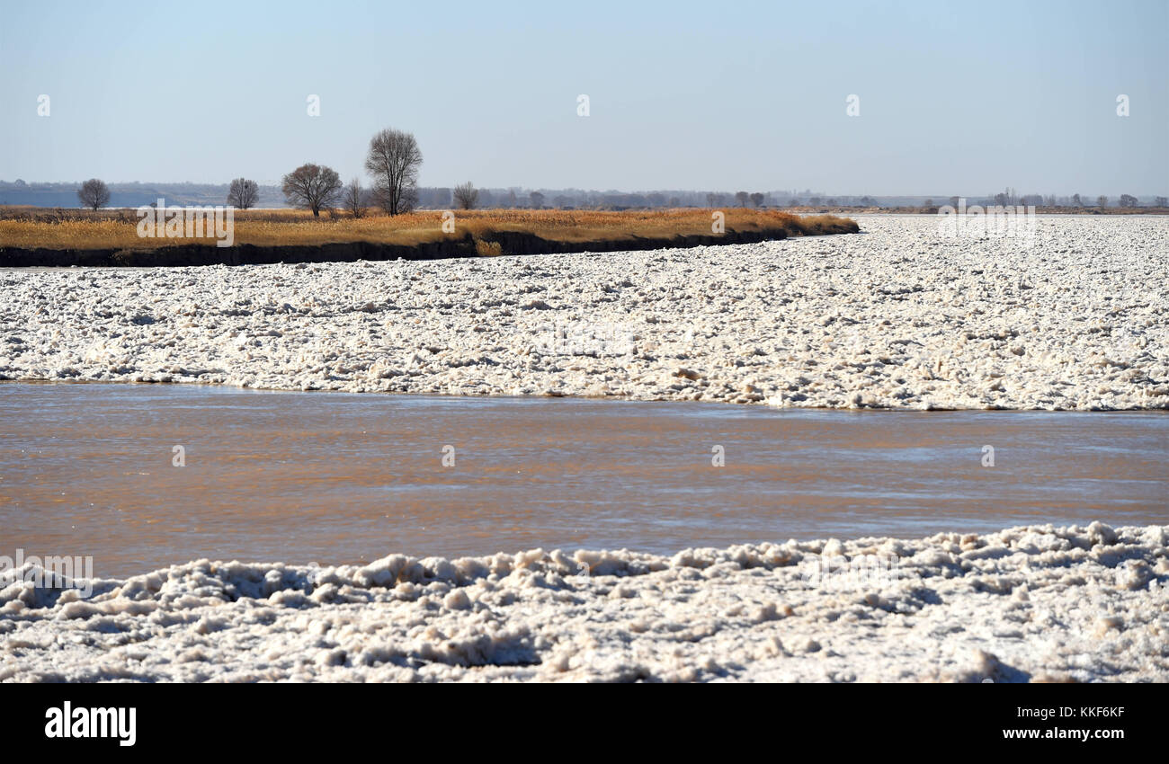 Hohhot. 5th Dec, 2017. Photo taken on Dec. 5, 2017 shows the frozen Yellow River at Togtoh section in north China's Inner Mongolia Autonomous Region. The length of frozen section of the Yellow River in Inner Mongolia has reached 139 kilometers by 4:00 p.m. Tuesday. The Yellow River Flood Control and Drought Relief Headquarters announced the beginning of the river's freeze-up period Monday. Credit: Deng Hua/Xinhua/Alamy Live News Stock Photo