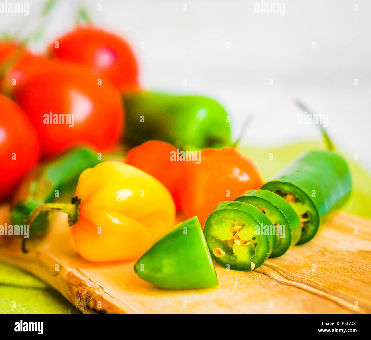 Assorted Pepper And Tomatoes On Wooden Background Stock Photo