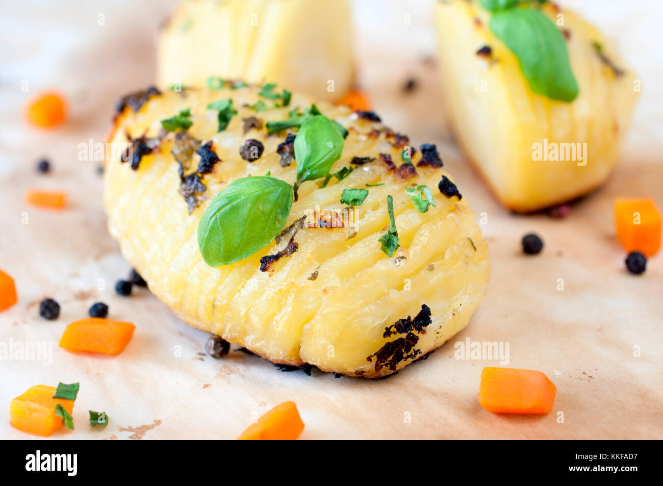 Baked potatoe with chive and sliced carrots Stock Photo