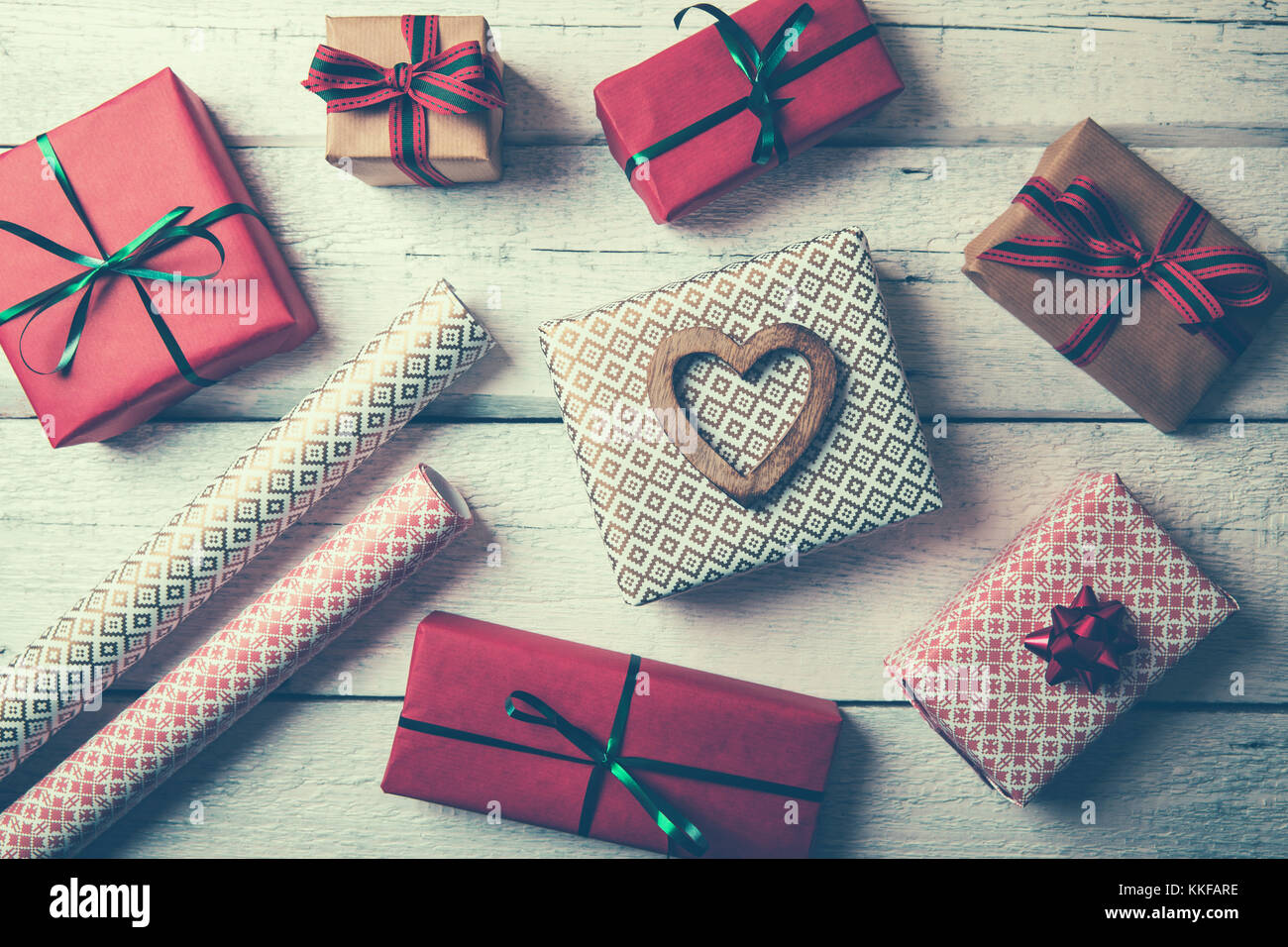 packed gifts and wrapping paper on white wood table. top view Stock Photo