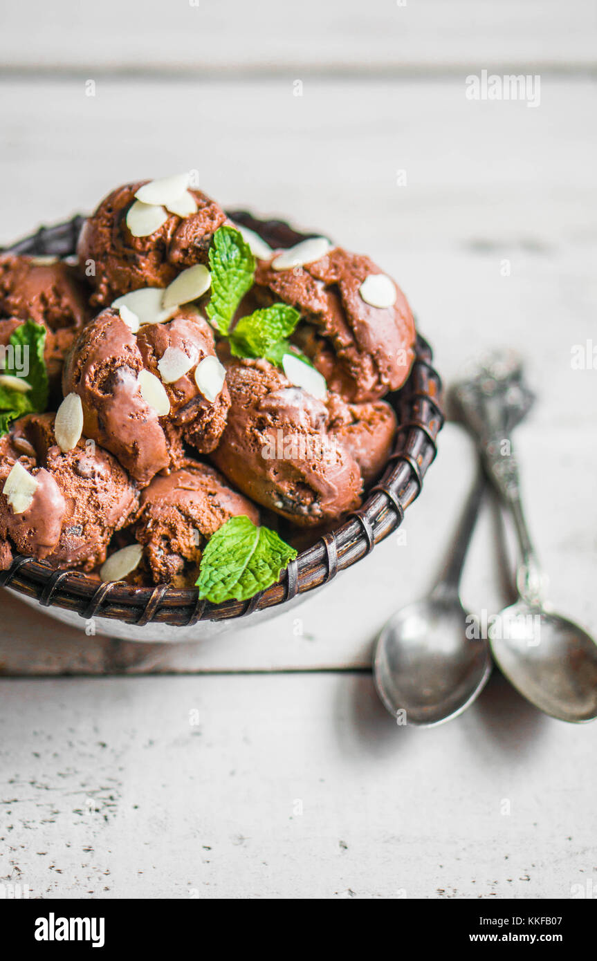Chocolate Ice Cream With Mint And Almonds On Wooden Background Stock Photo