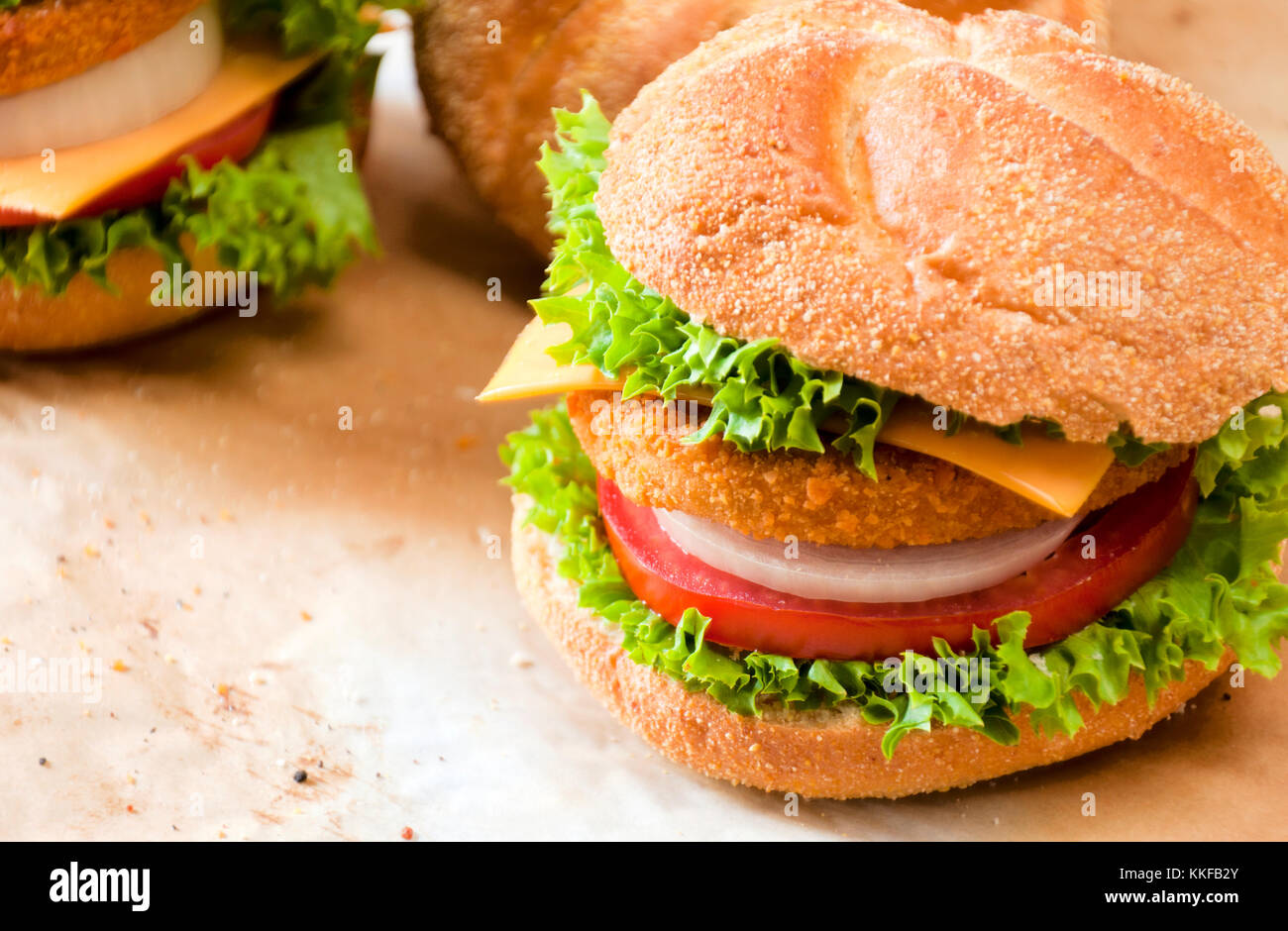 Close up to fishburger and fresh vegetables Stock Photo