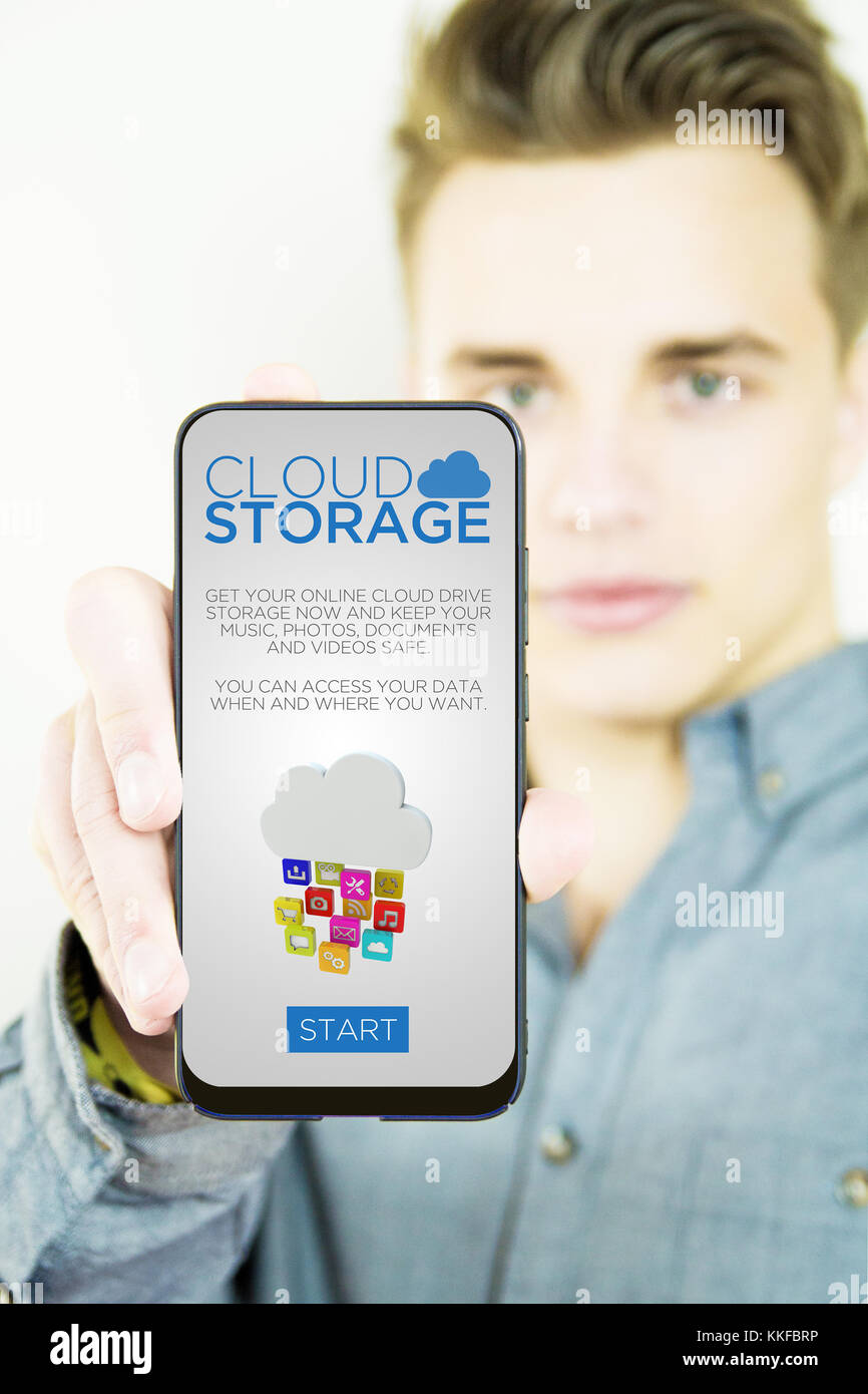 Handsome millennial showing generic cloud storage full screen smartphone Stock Photo