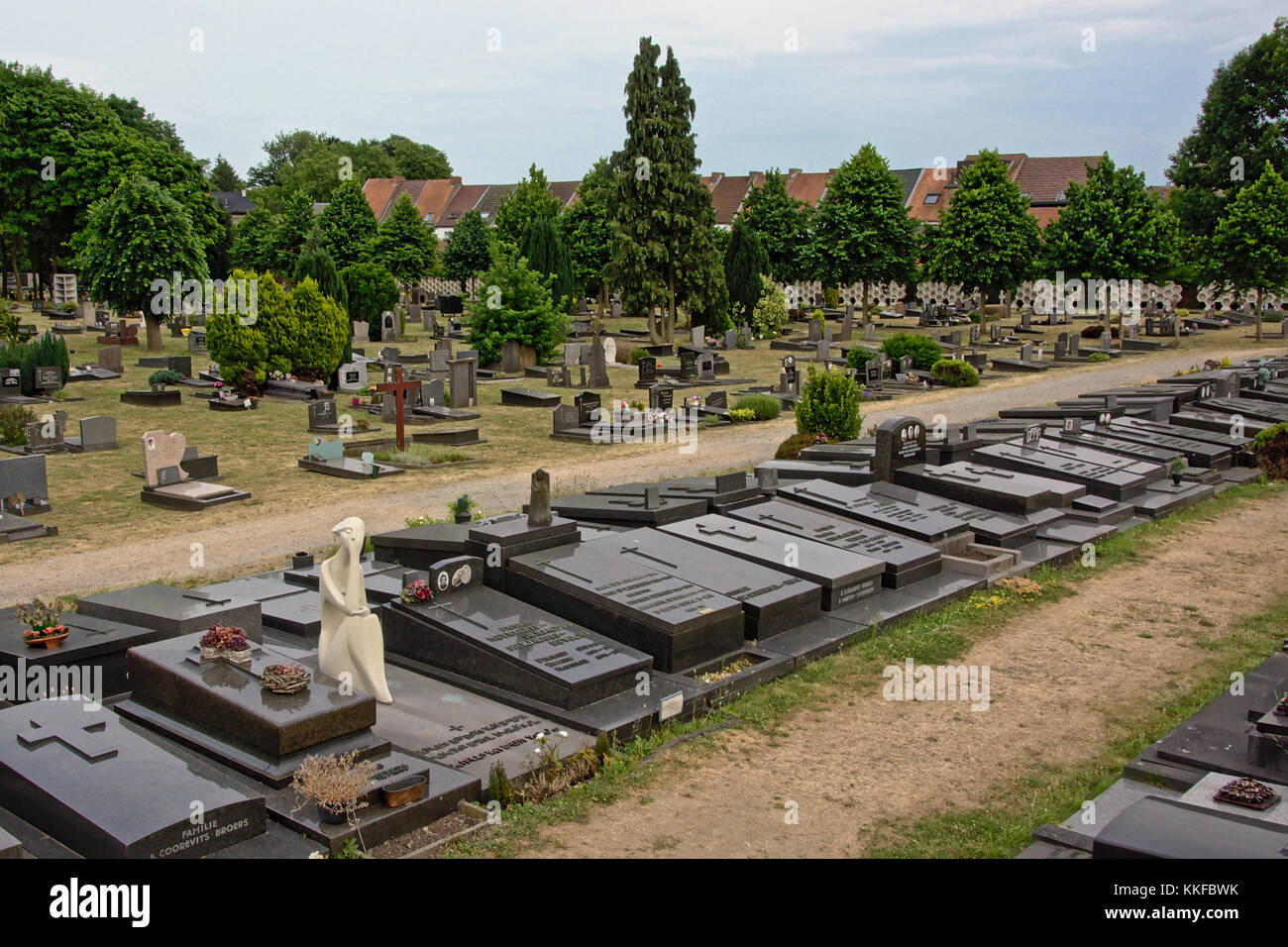 Stone grave monuments in a meadow on the Campo Santo cemetery in Ghent, Flanders, Belgium Stock Photo
