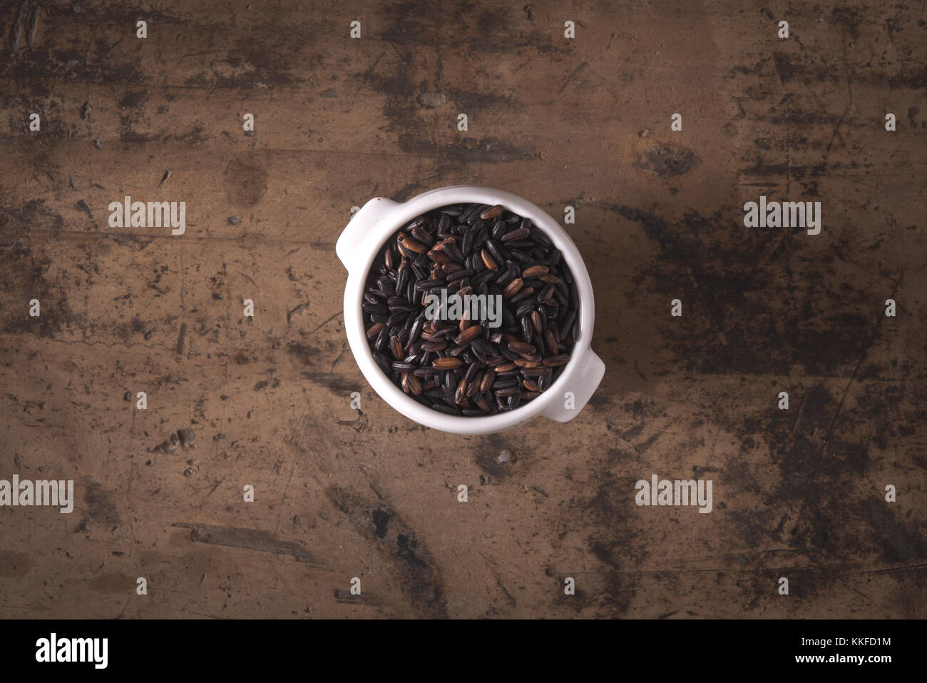 Venere black italian red rice cultivar on wood background Stock Photo ...