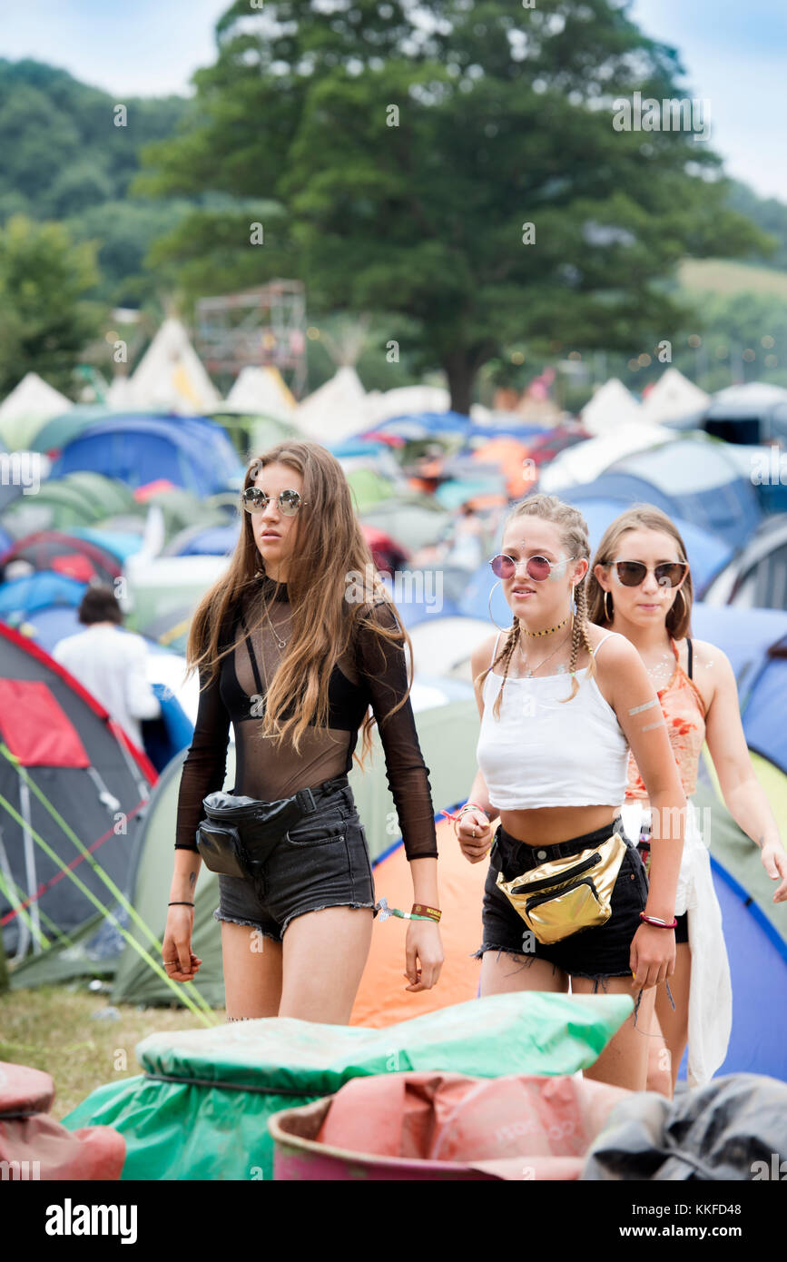 Girls leaving a campsite at the Glastonbury Festival 2017 Stock Photo