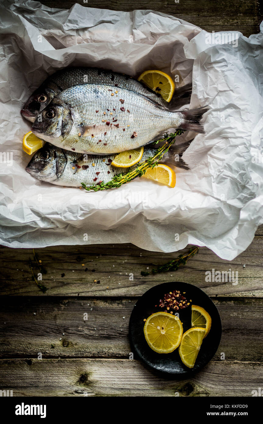 Fresh Sea Bream On Wooden Board Stock Photo