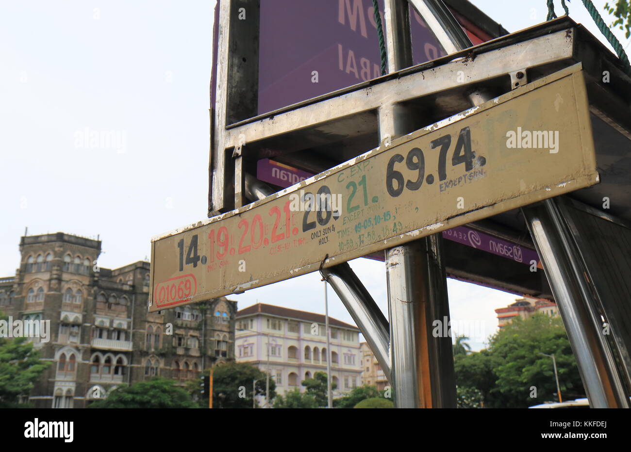 Bus stand displays bus numbers in downtown Mumbai India Stock Photo Alamy