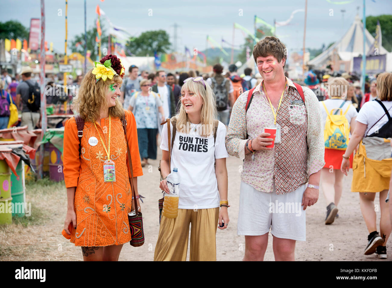 Festival goers with ‘Bun The Tories’ badge and t-shirt at Glastonbury 2017 Stock Photo