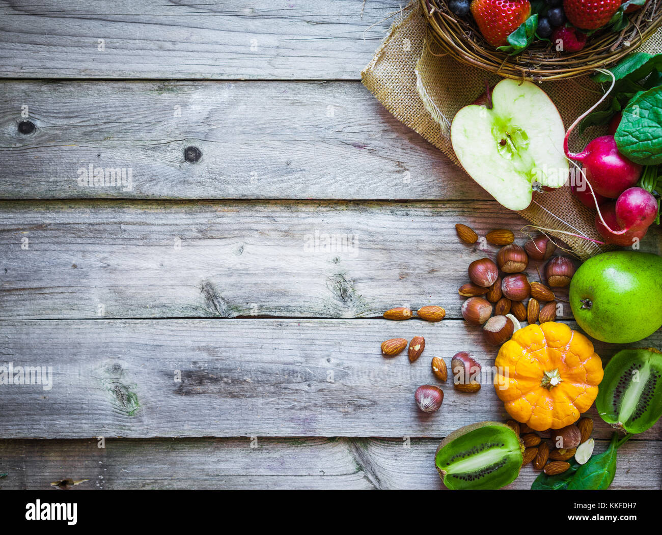 Fruits and vegetables on rustic background Stock Photo - Alamy