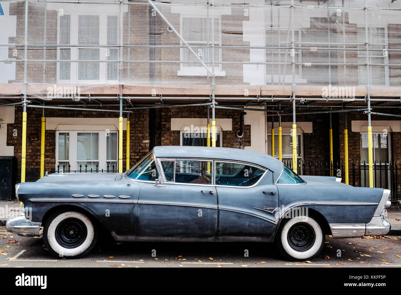 Classic American Car outside some properties in London undergoing regeneration Stock Photo
