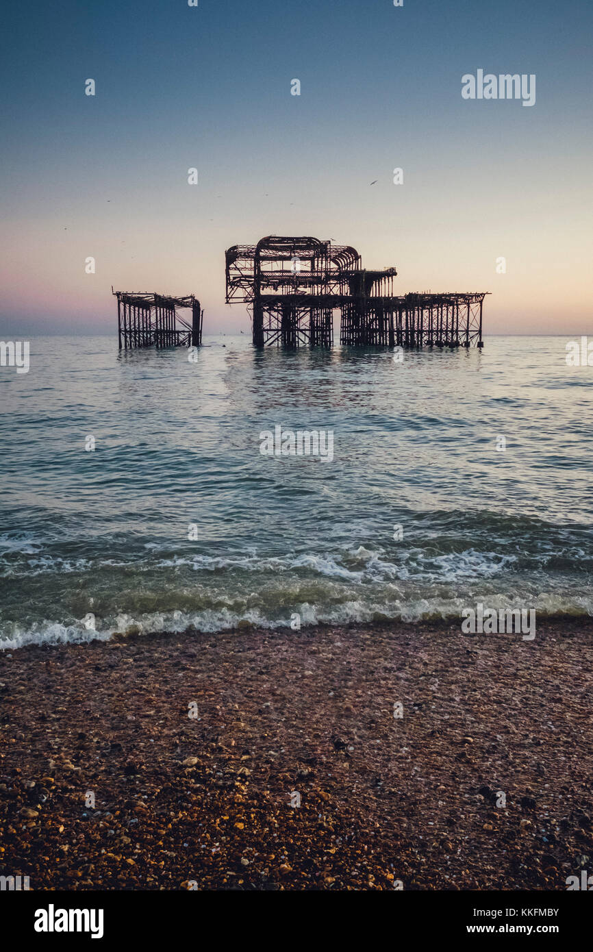 Burnt West Pier at dusk, Brighton, England Stock Photo