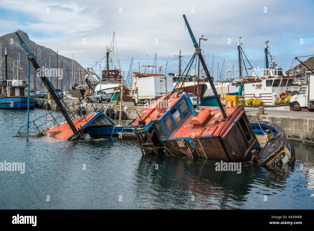 Sunken fishing boat in the harbor of Kalk Bay, False Bay, South Africa Stock Photo