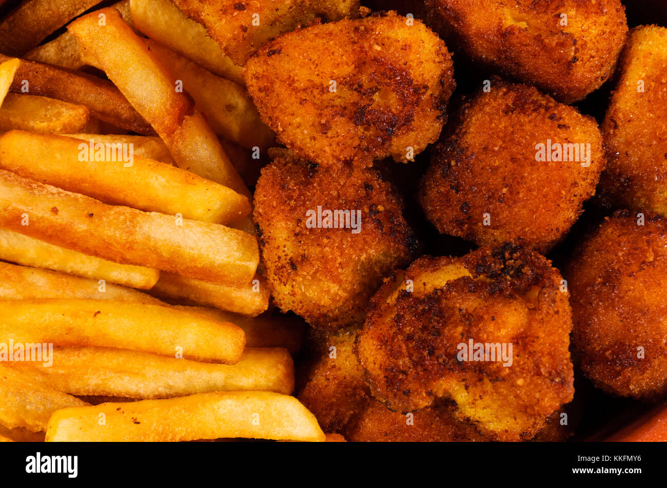 French fries and chicken balls in full frame Stock Photo