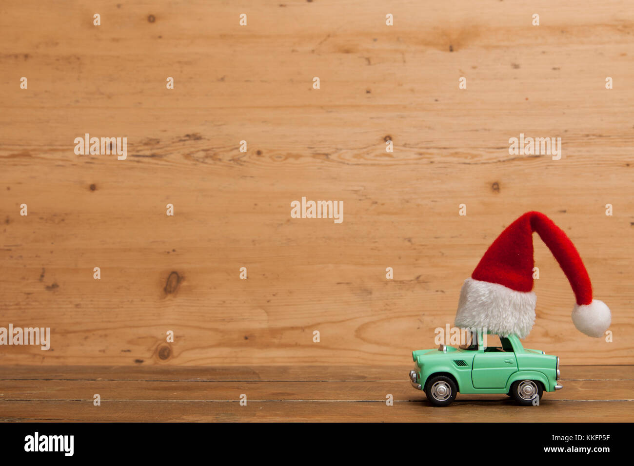 LONDON, UK - DECEMBER 30th 2016: Christmas background concept. Toy car with a Santa hat Stock Photo