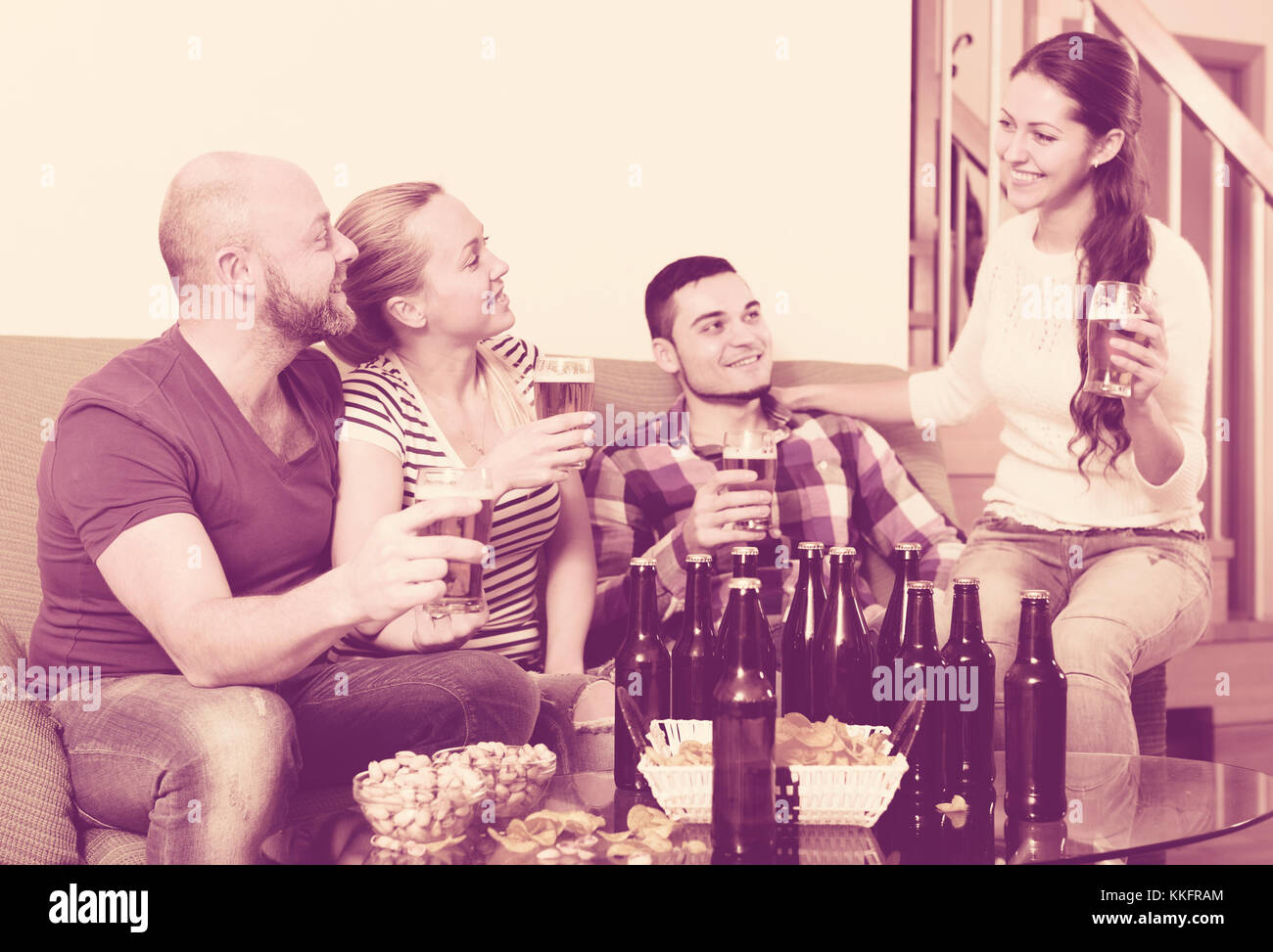 Two couples having fun at house party together at home Stock Photo Alamy