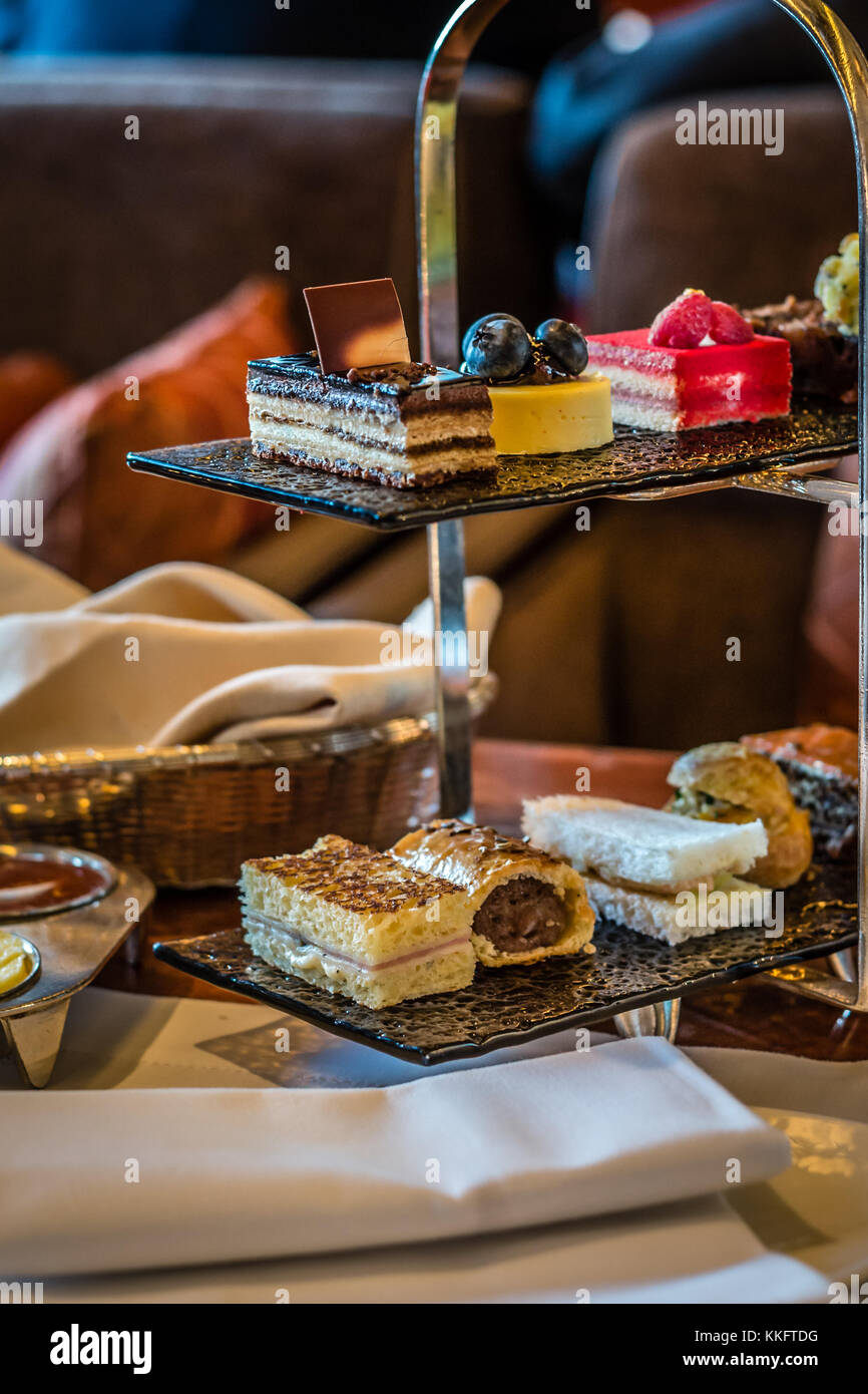 three tier afternoon tea set and pastries Stock Photo - Alamy