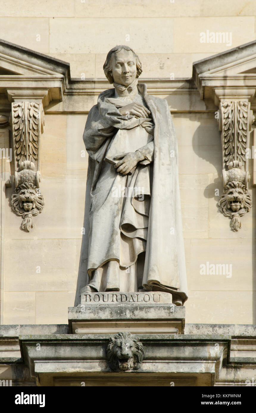 Paris, France. Palais du Louvre. Statue in the Cour Napoleon: Louis Bourdaloue (1632 – 1704) French Jesuit and preacher. Stock Photo