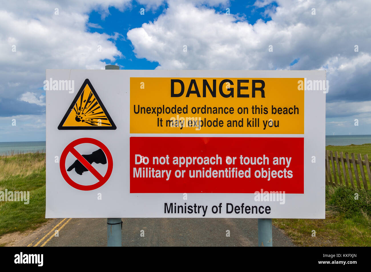 Warning sign: 'Unexploded ordnance on the beach', seen in Aldbrough, East Riding of Yorkshire, UK Stock Photo