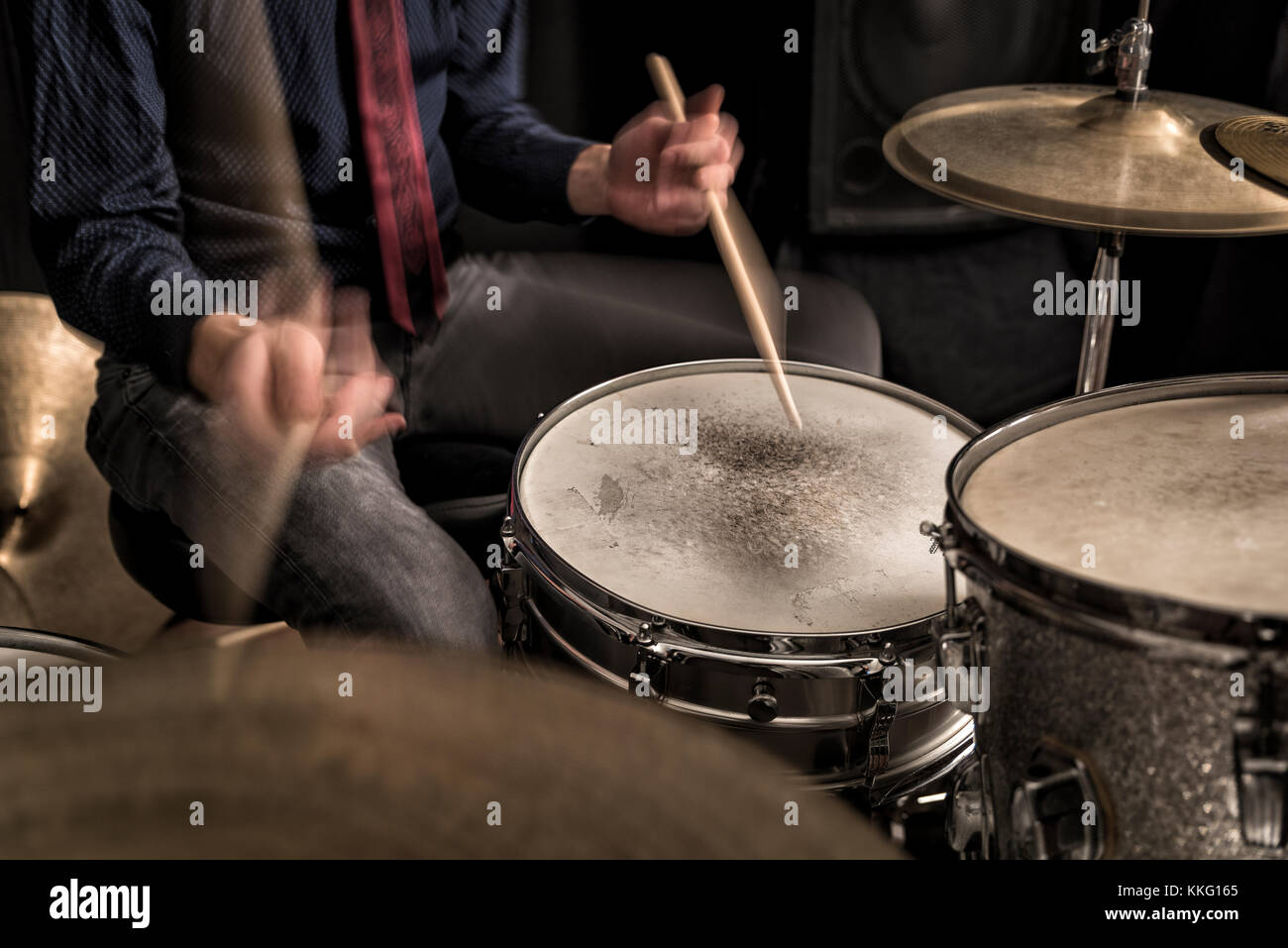 Drummer playing a rhythm,  closeup, front view Stock Photo