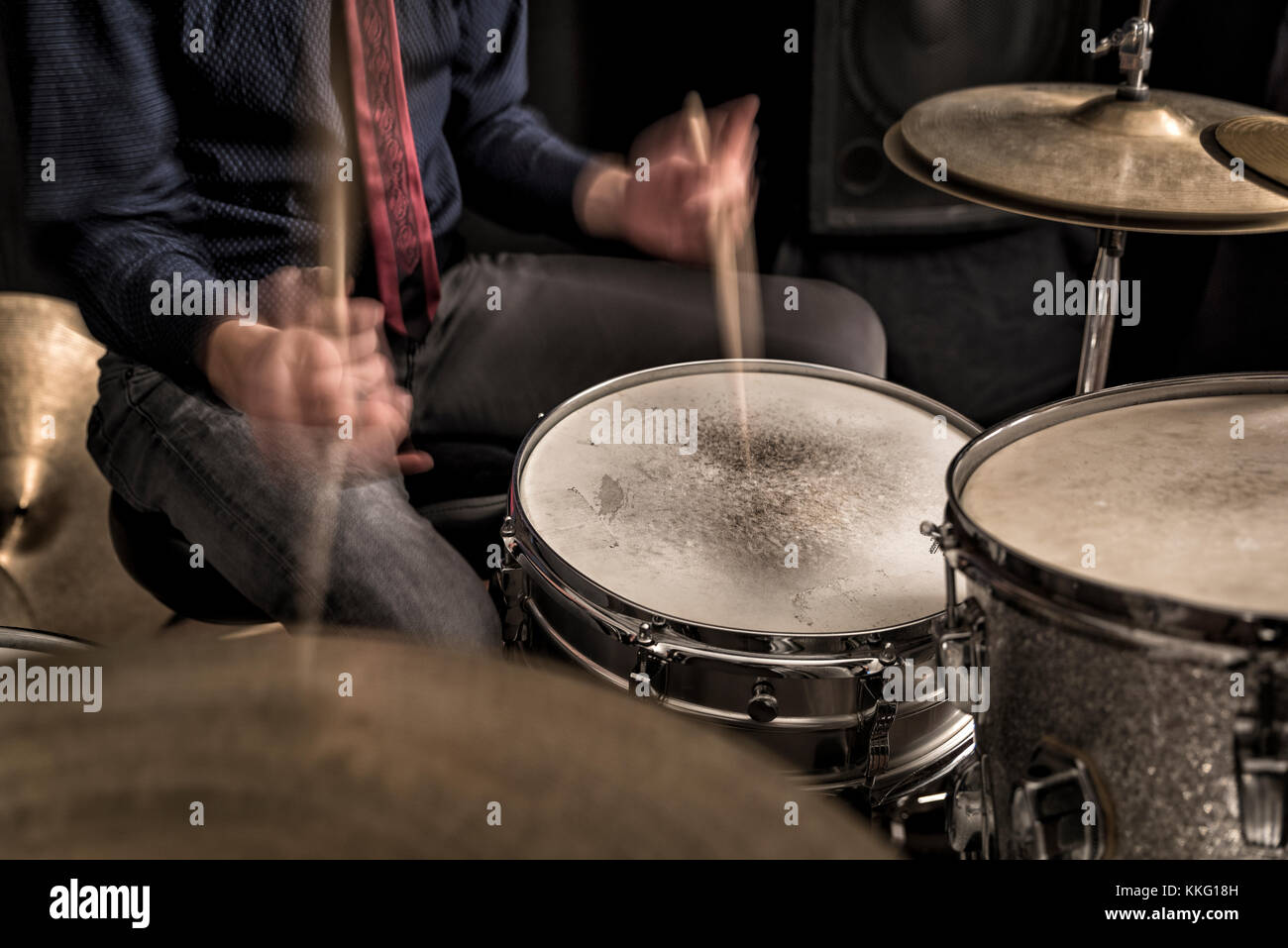 Drummer playing a rhythm,  closeup, front view Stock Photo