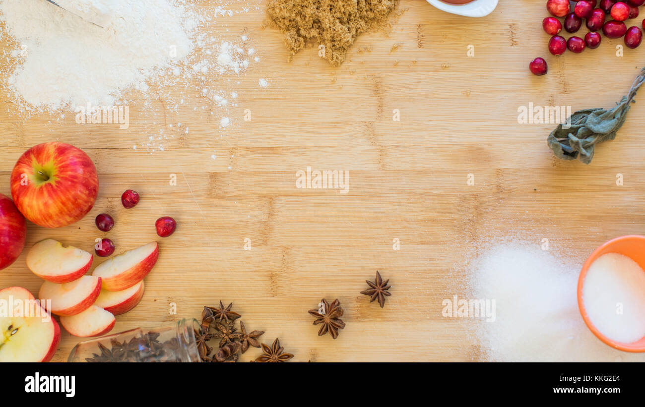 Apple Spice baking ingredients decoratively arranged in a circle on a wooden cutting board Stock Photo