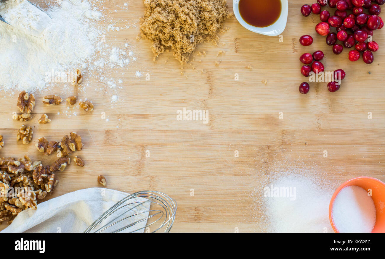 Ingredients for Cranberry Walnut Sauce decoratively arranged in a circle on a wooden cutting board Stock Photo