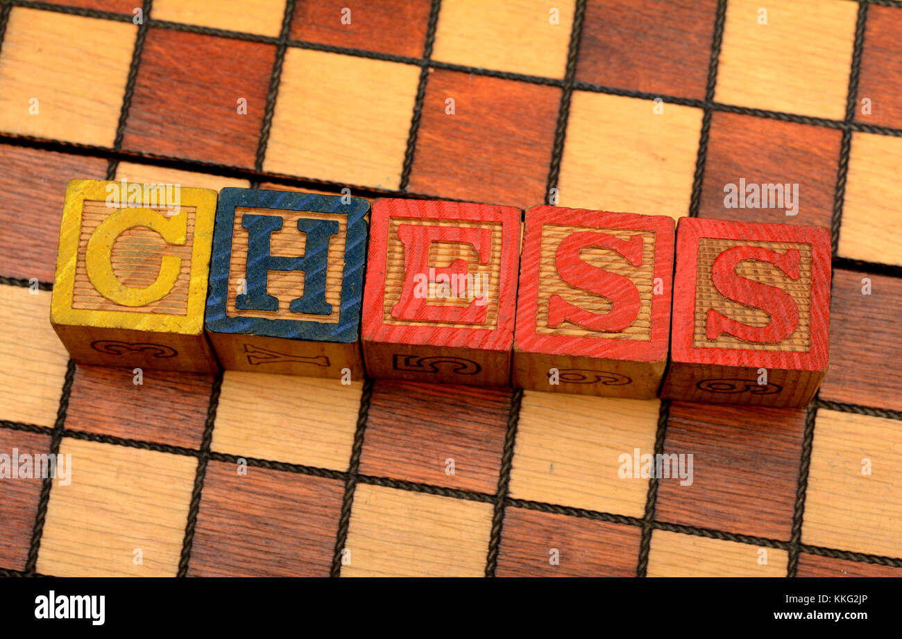 Word Chess on chessboard background Stock Photo