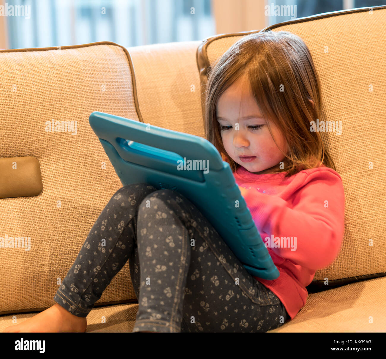 Child playing with computer tablet hi-res stock photography and images ...