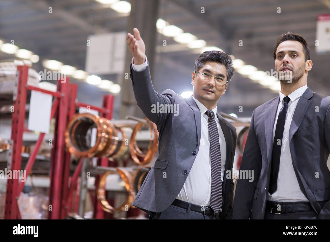 Business people talking in the factory Stock Photo