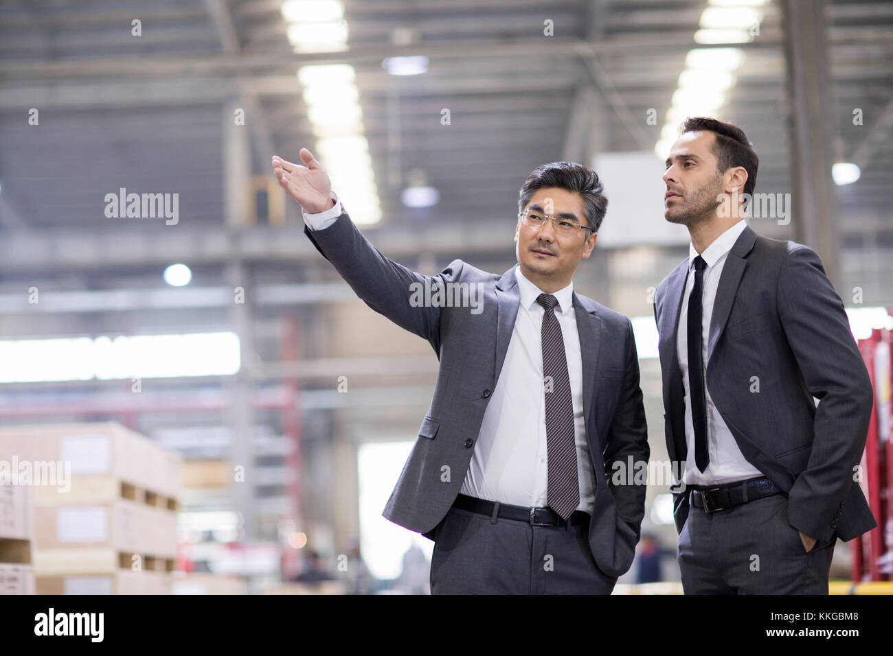 Business people talking in the factory Stock Photo