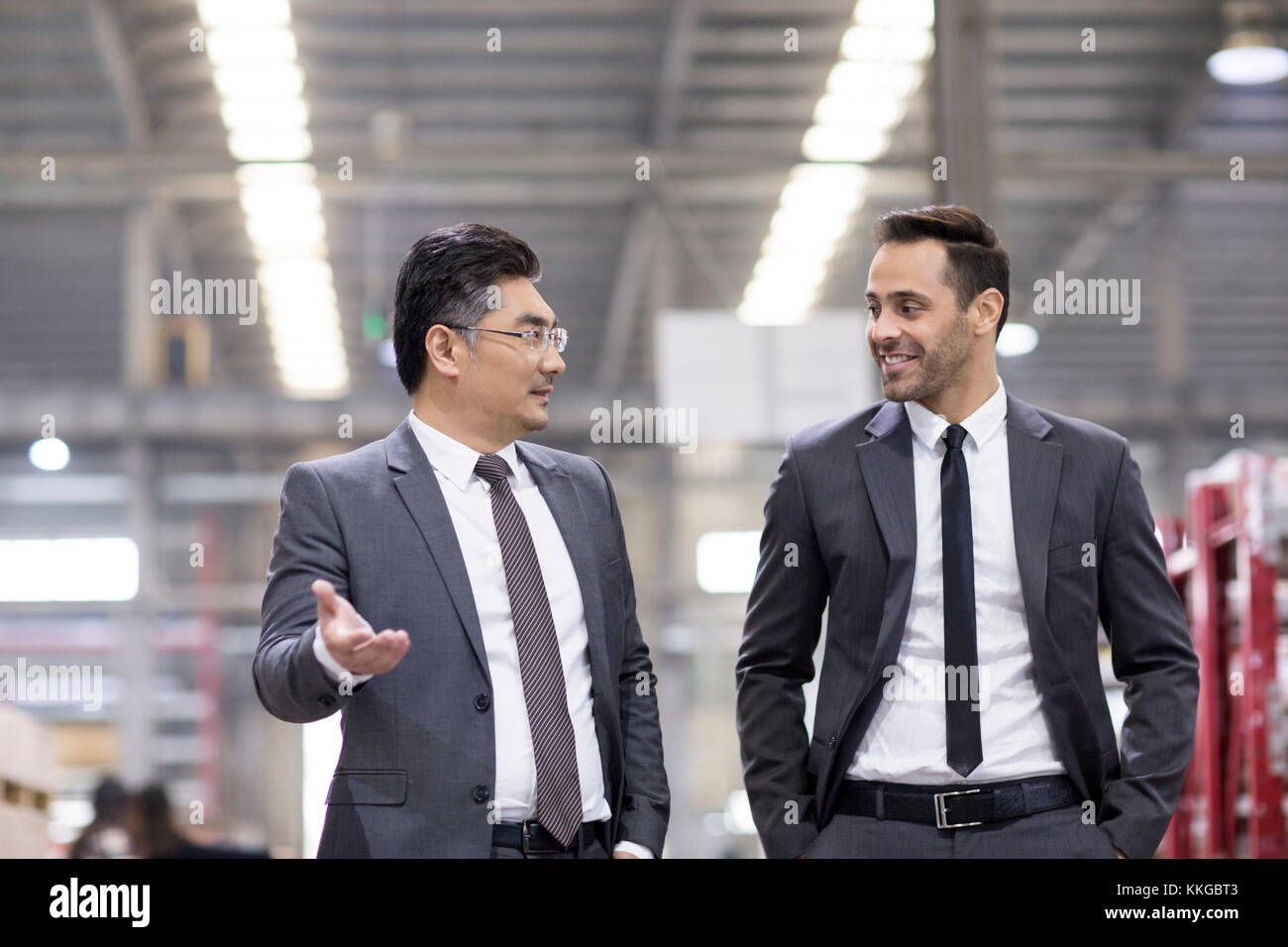 Business people talking in the factory Stock Photo