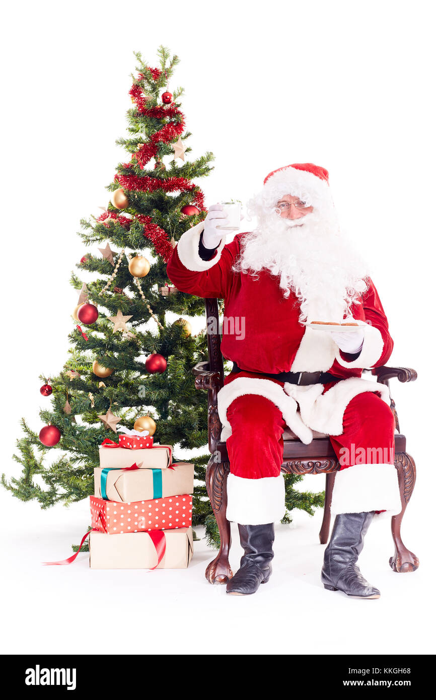Santa near Christmas tree Stock Photo
