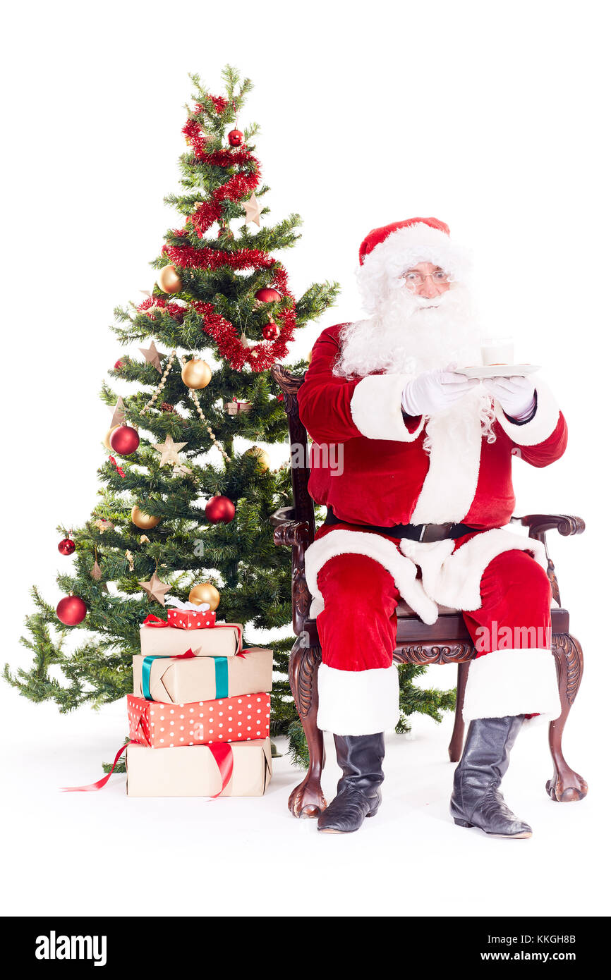 Santa near Christmas tree Stock Photo