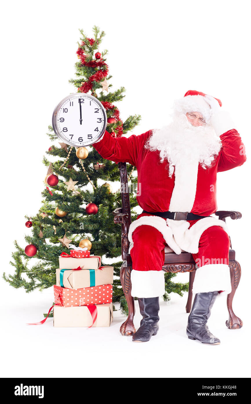 Santa near Christmas tree Stock Photo