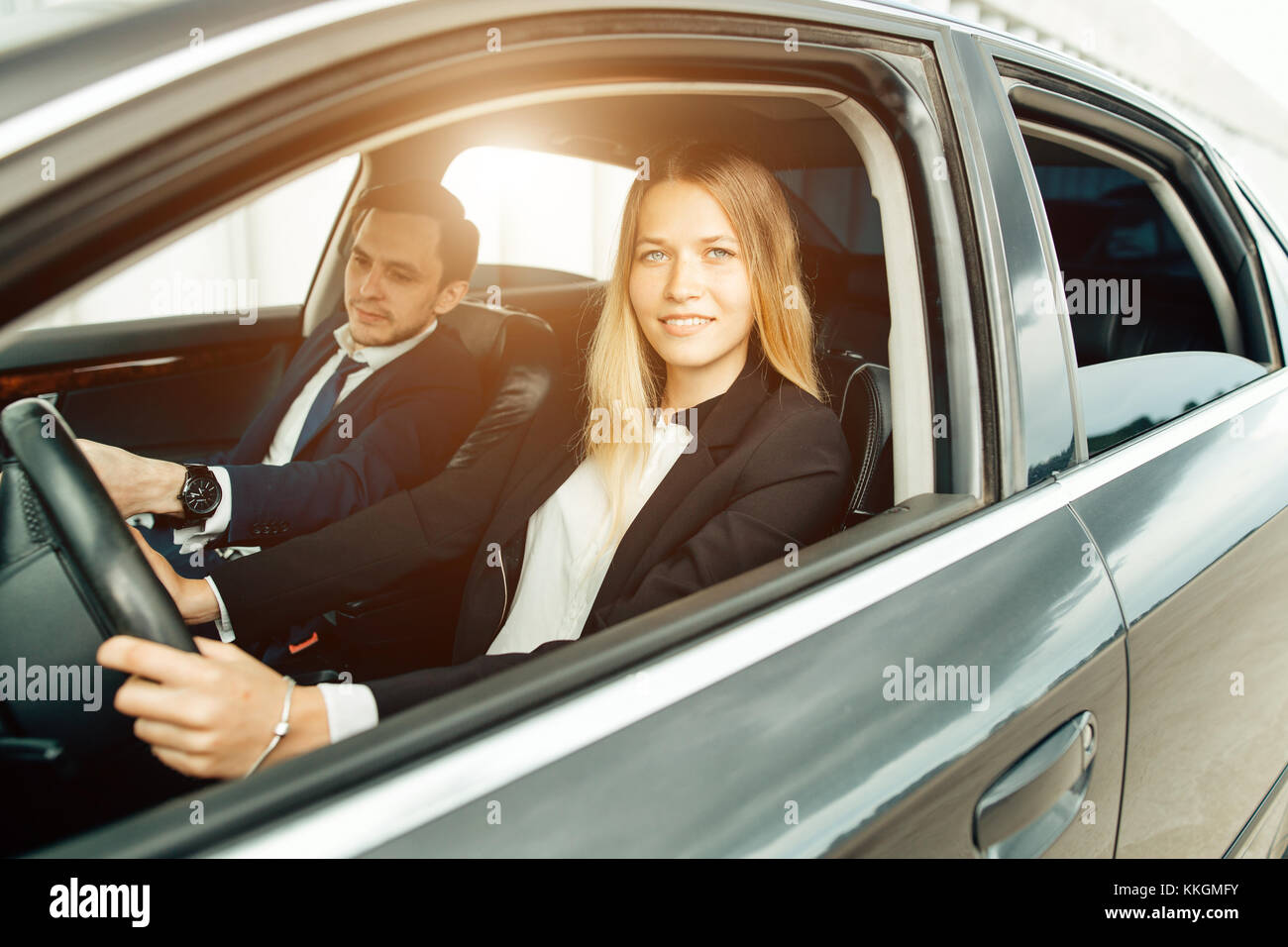 Driving School woman steer car with steering wheel, maybe she has