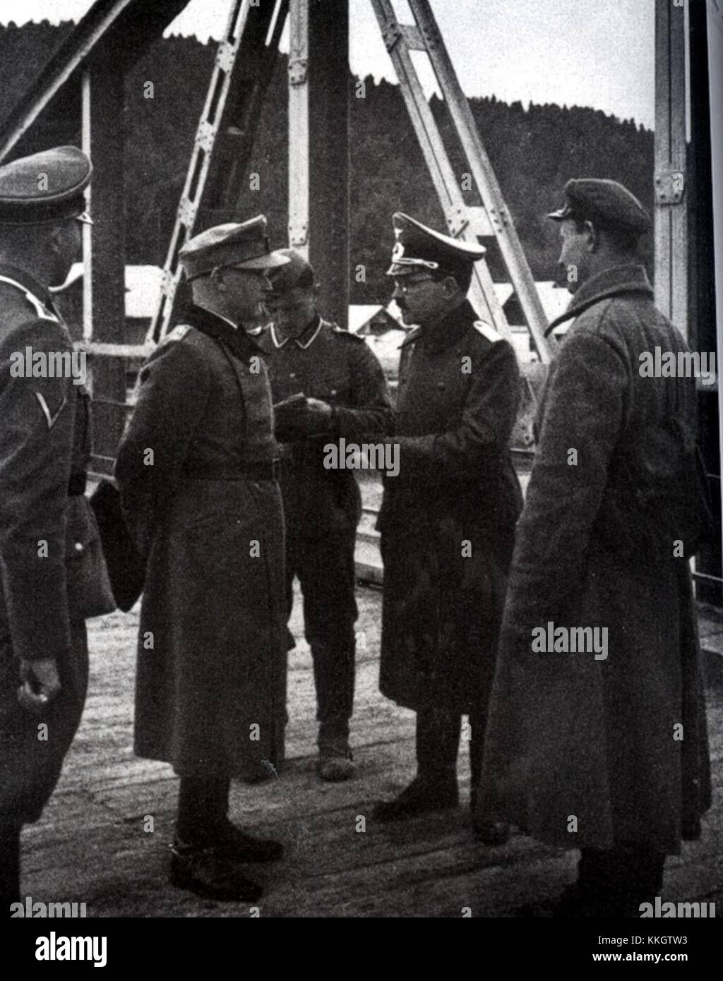 The meeting of German and Soviet soldiers in Lesko on the San River in 1939 marks a significant event during World War II, reflecting the political and military dynamics of the time. The encounter occurred shortly after the Molotov-Ribbentrop Pact, highlighting the historical context of the period. Stock Photo
