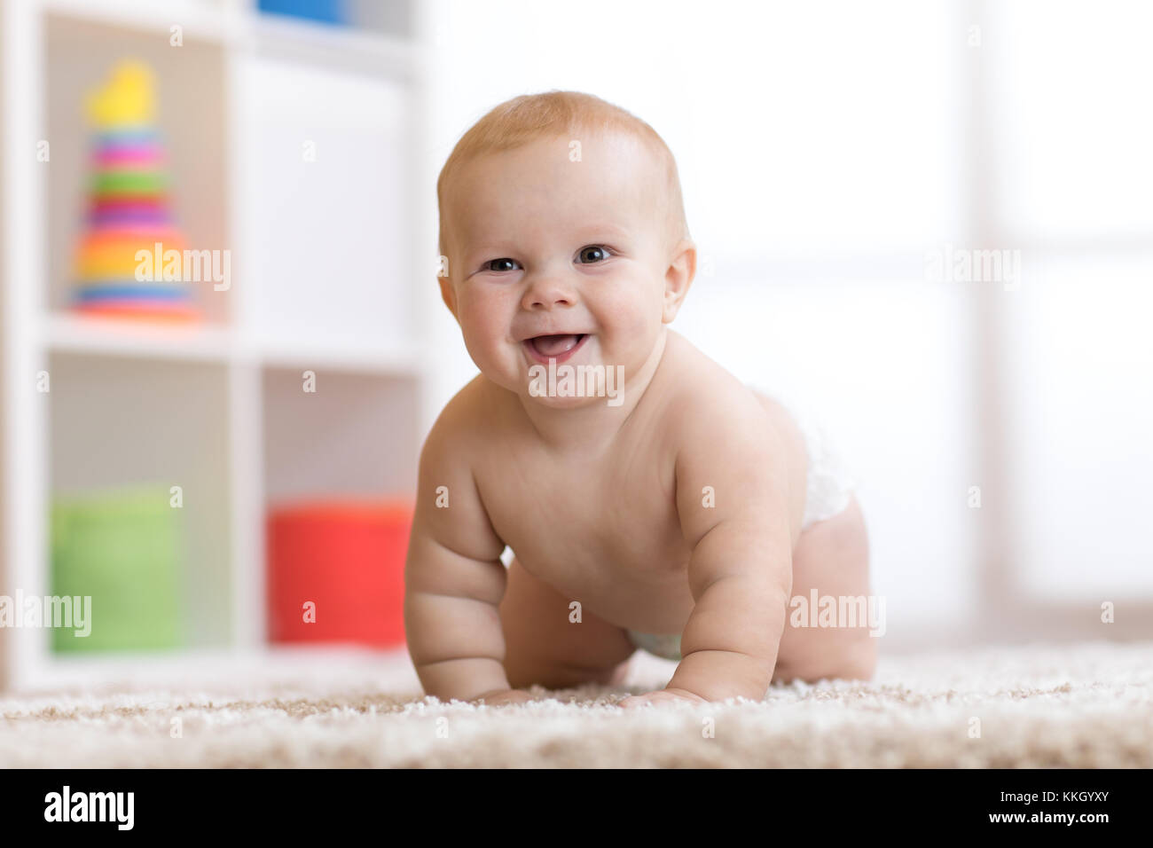 crawling baby boy at home on floor Stock Photo