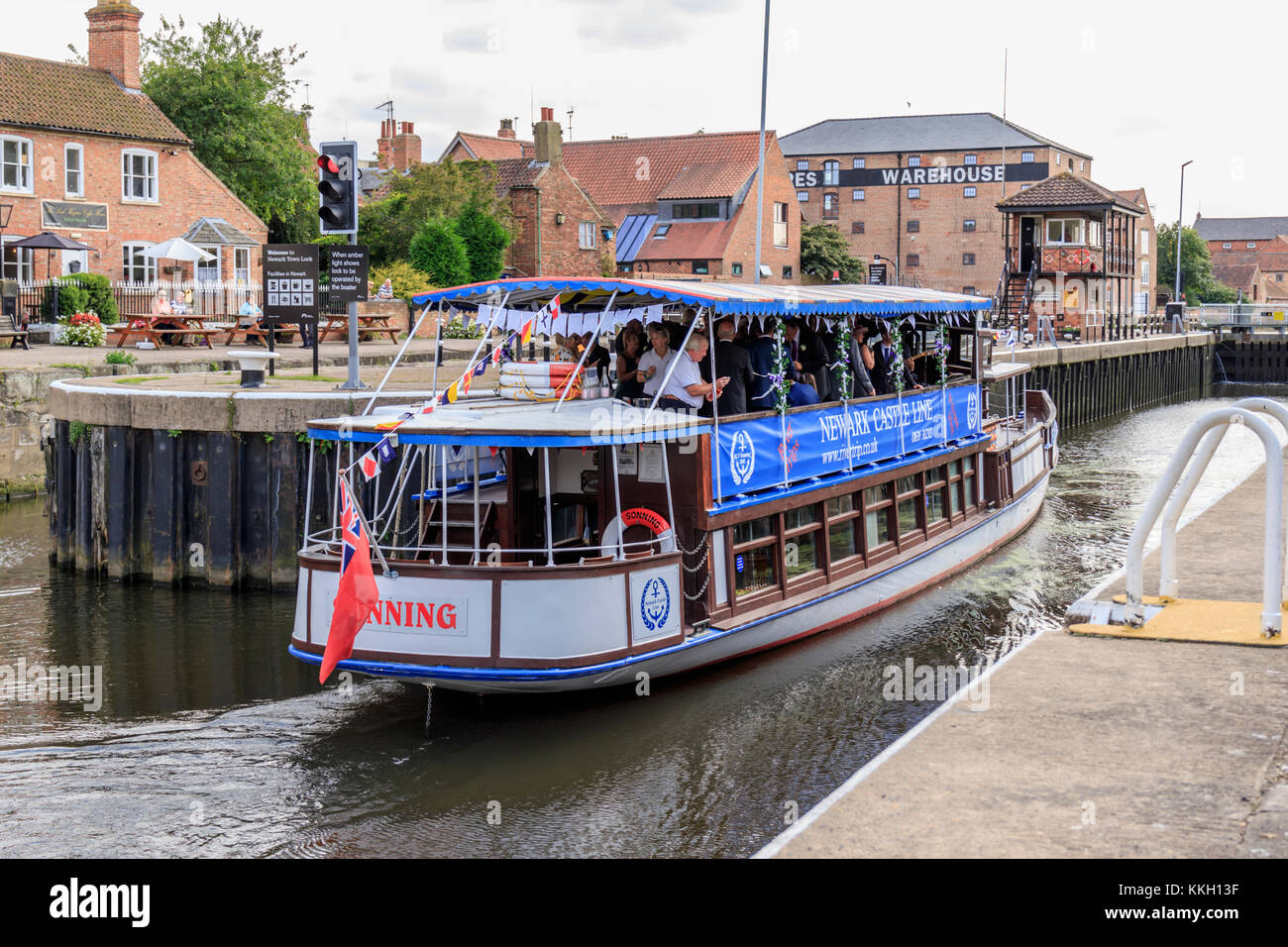 Newark on Trent river pleasure cruiser The Sonning underway and entering the town locks with a wedding party on board. Nottinghamshire UK Stock Photo