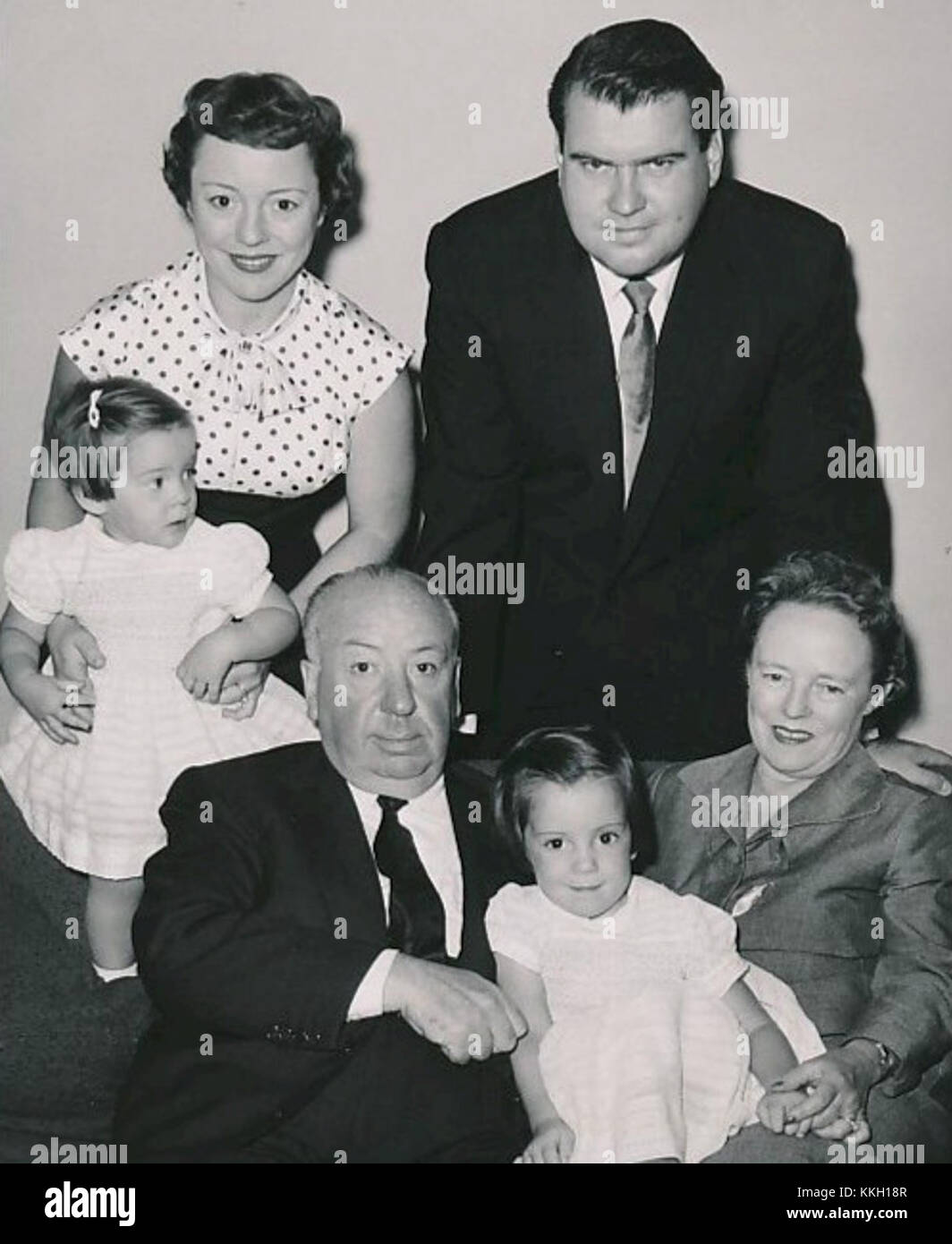 This image captures Alfred Hitchcock and his family around 1955