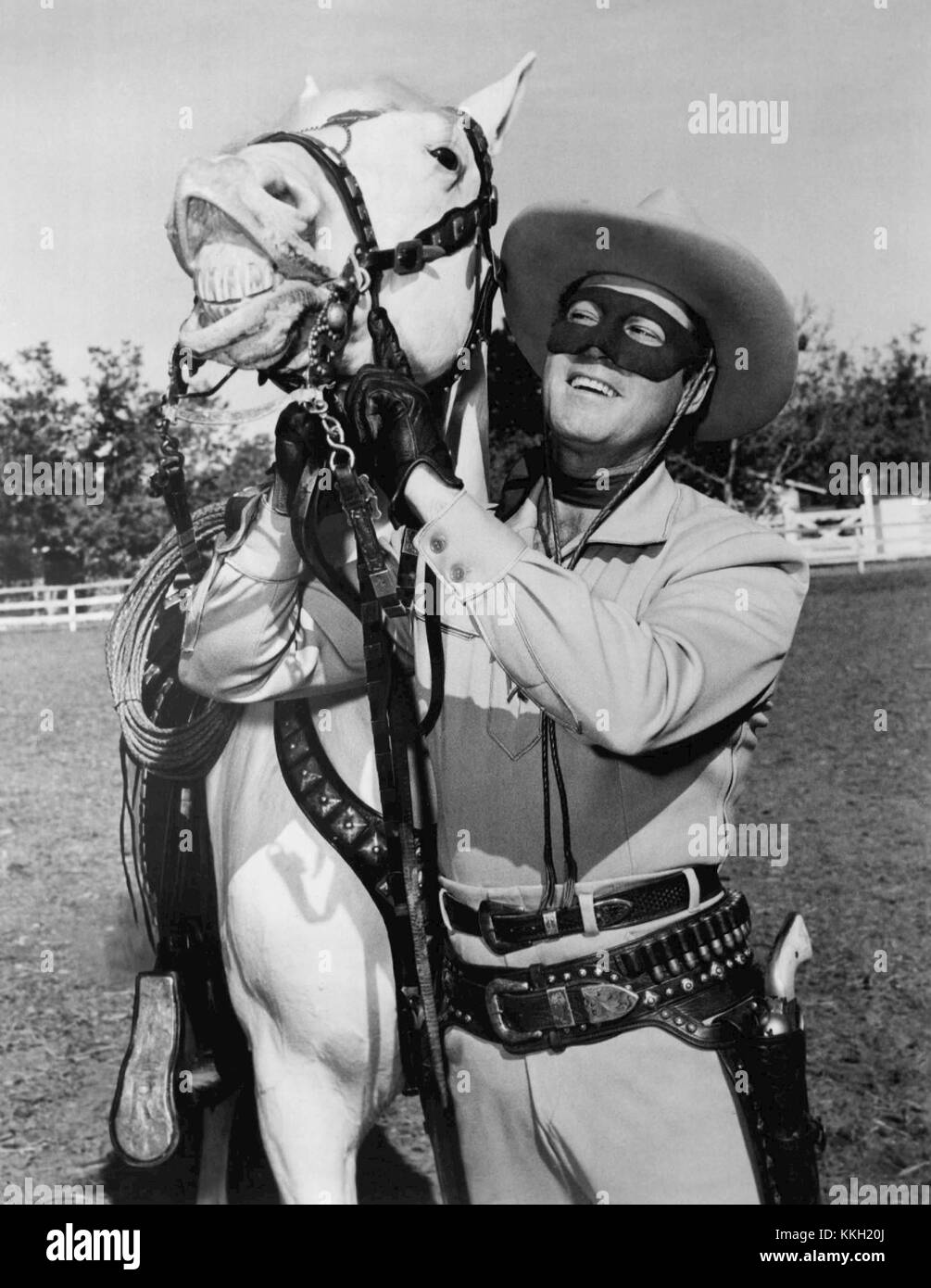The Lone Ranger, a popular American fictional character, was featured alongside his trusted horse Silver in 1955. The duo is known for their role in Western television shows and comic books, where the Lone Ranger fights injustice with the aid of Silver and his other companions. Stock Photo
