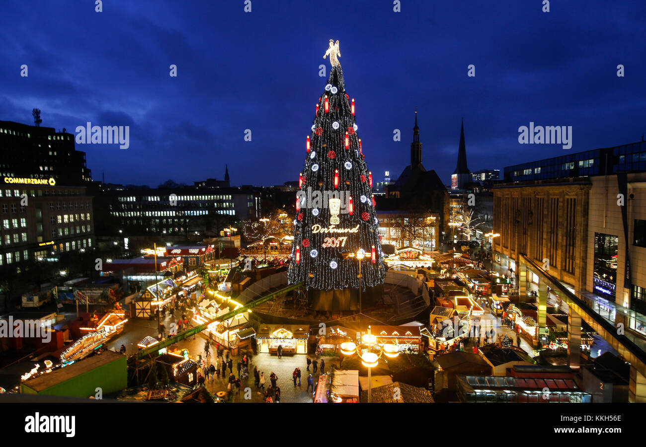 The according to the organisers biggest Christmas tree in the world illuminates the Christmas market in Dortmund, Germany, 30 November 2017. The tree measures 45 meters in height and is decorated with 48,000 lights. It is made of 1,700 red spruce trees, arranged on a scaffolding with a foundation of 400 square meters. Photo: Ina Fassbender/dpa Stock Photo