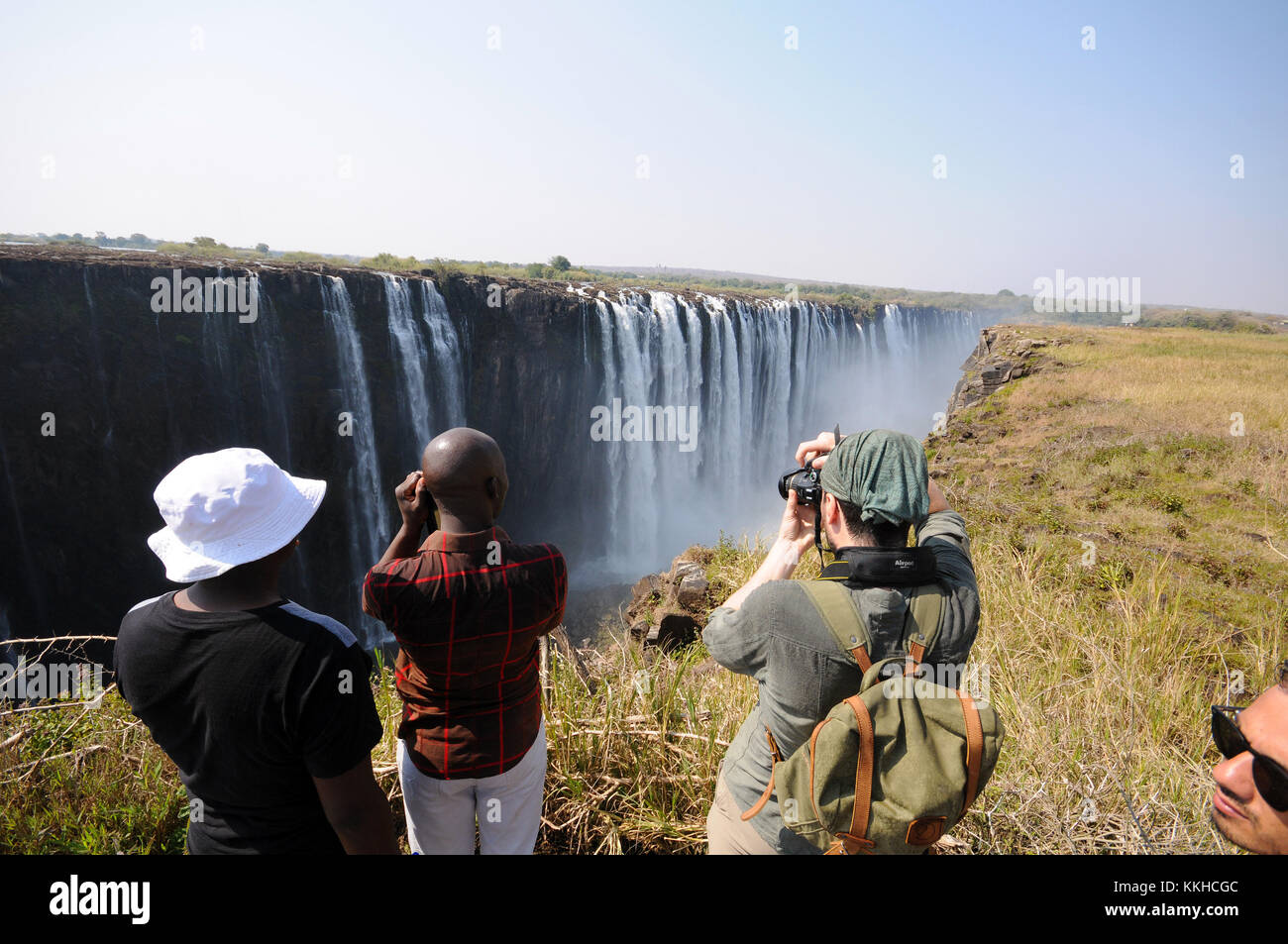 Victoria Falls, Zimbabwe. 30th July, 2015. A group of tourists photograph the socalled