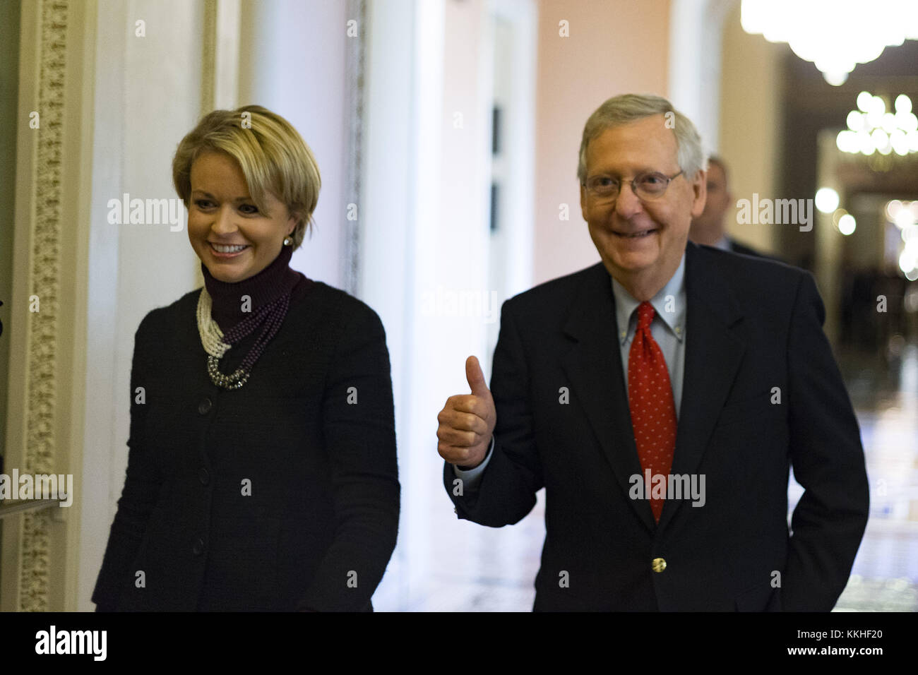 Washington, District of Columbia, USA. 1st Dec, 2017. United States Senate Majority Leader Mitch McConnell (Republican of Kentucky) gives a thumbs up as he walks with a staffer from his office to the Senate chamber for a procedural vote to move forward with voting on the Republican proposed tax reform bill at the United States Capitol in Washington, DC on Friday, December 1, 2017.Credit: Alex Edelman/CNP Credit: Alex Edelman/CNP/ZUMA Wire/Alamy Live News Stock Photo