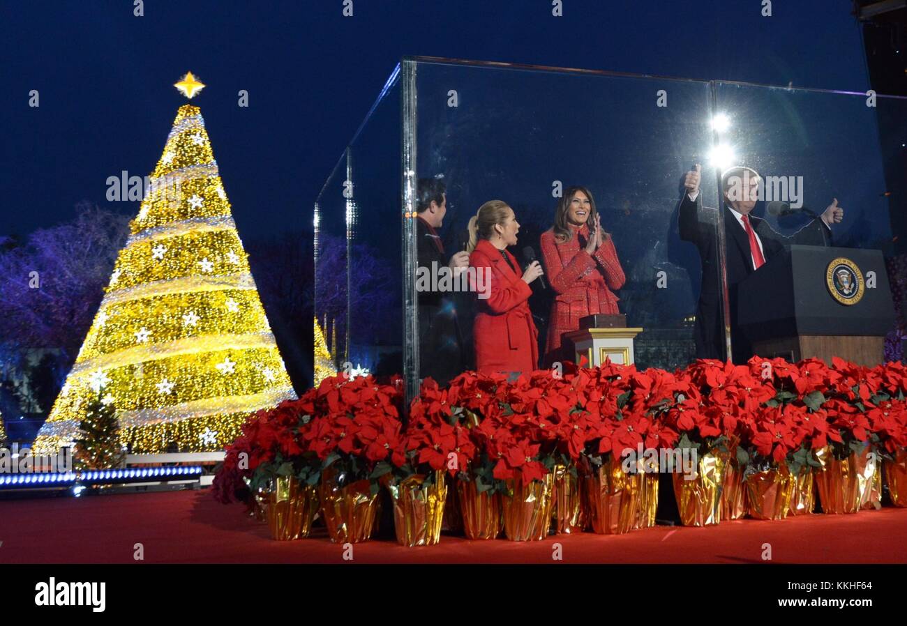 Washington, United States Of America. 30th Nov, 2017. U.S. President Donald Trump and First Lady Melania Trump stand behind bulletproof glass as they light the National Christmas Tree on the Ellipse November 30, 2017 in Washington, DC. Credit: Planetpix/Alamy Live News Stock Photo