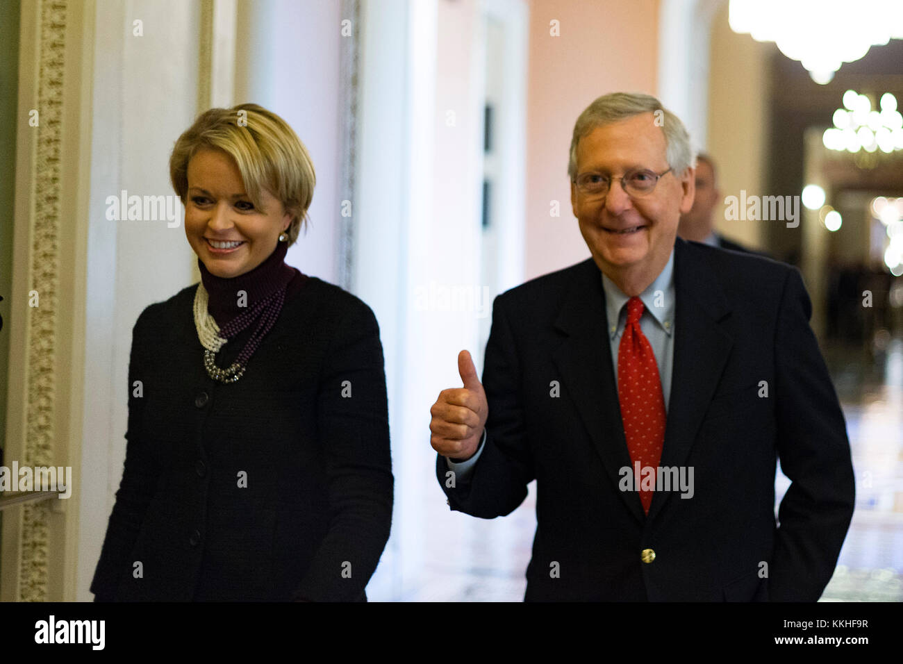 United States Senate Majority Leader Mitch McConnell (Republican of Kentucky) gives a thumbs up as he walks with a staffer from his office to the Senate chamber for a procedural vote to move forward with voting on the Republican proposed tax reform bill at the United States Capitol in Washington, DC on Friday, December 1, 2017. Credit: Alex Edelman/CNP /MediaPunch Stock Photo